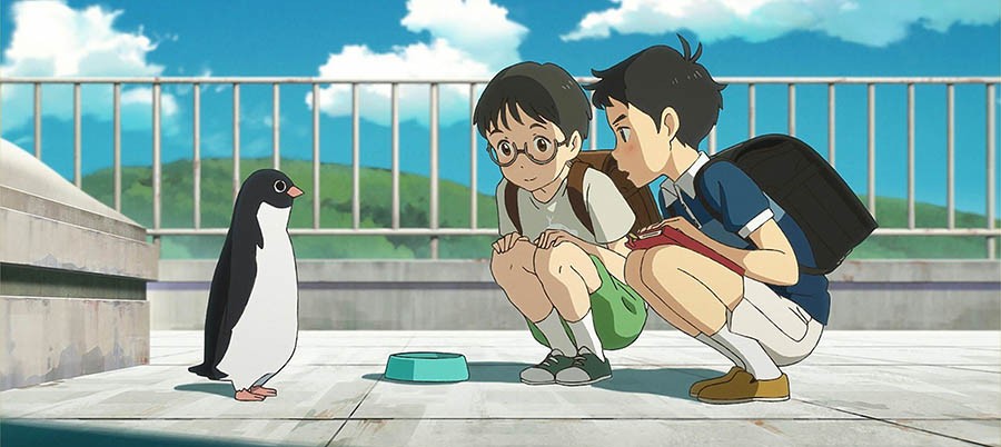 Scene from the Anime "Penguin Highway", two 10 year old boys crouch in front of a penguin on a roofboy.