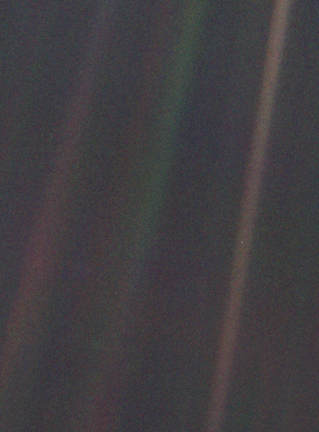 A picture of space, where the earth is a single tiny blue pixel in the deep darkness.